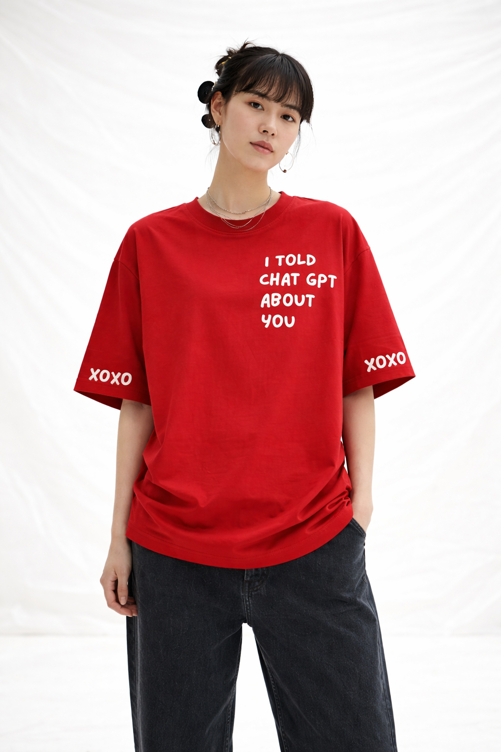 Person wearing a red t-shirt with text on a white background